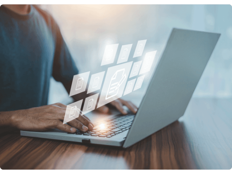 Person using a laptop to plan and analyse business documents
